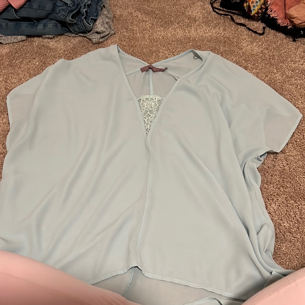 Light blue/teal blouse